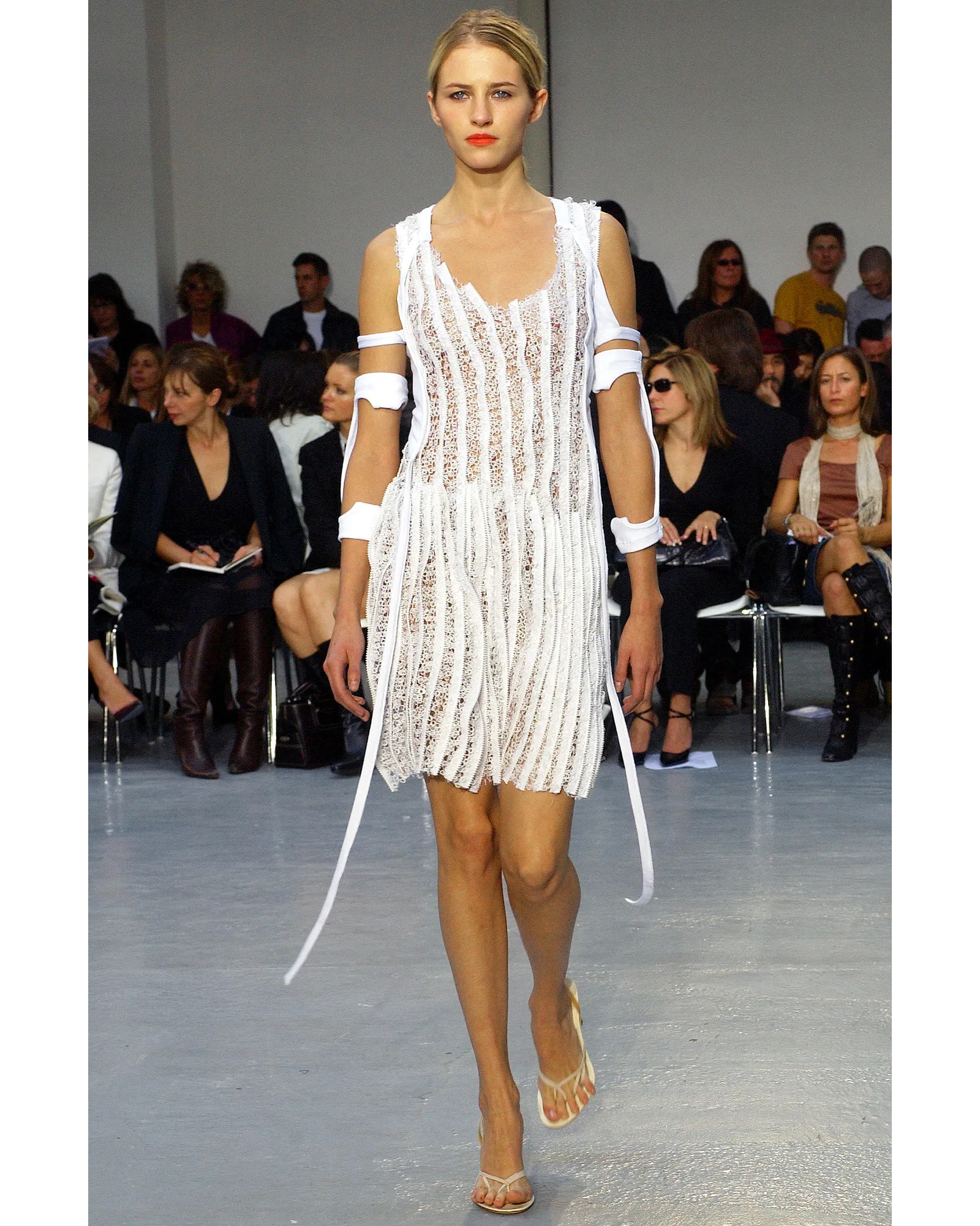 paris fashion week 2003 dress Elie Saab Haute Couture Fall 2003 collection brought shimmering glamour to the Paris couture runway with ultra-short silhouettes, sheer fabrics, sequined embroidery, flowing chiffon layers, and metallic coin details woven throughout the
